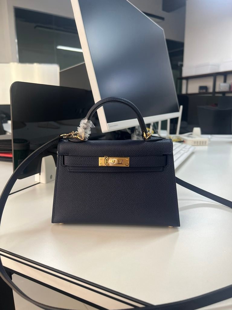 Hermès Kelly structured top-handle handbag with a refined silhouette