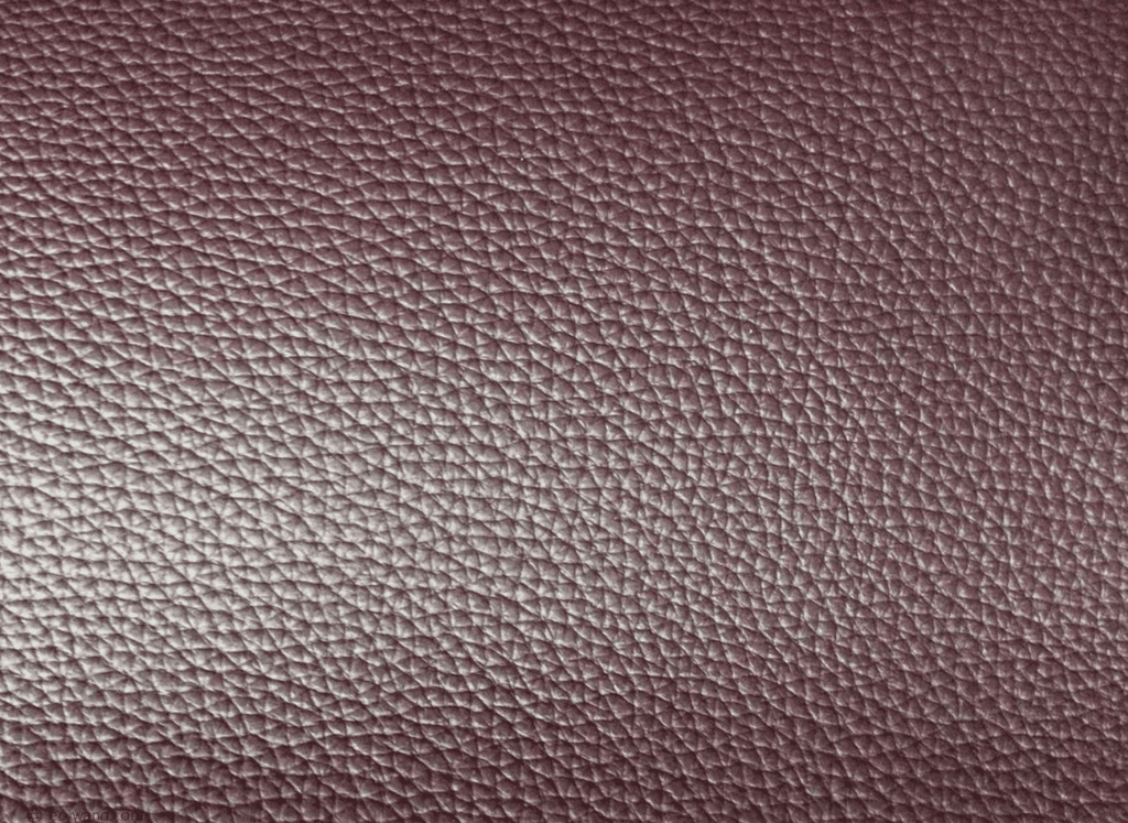 Close-up of coated split leather showing a finished grain-like surface