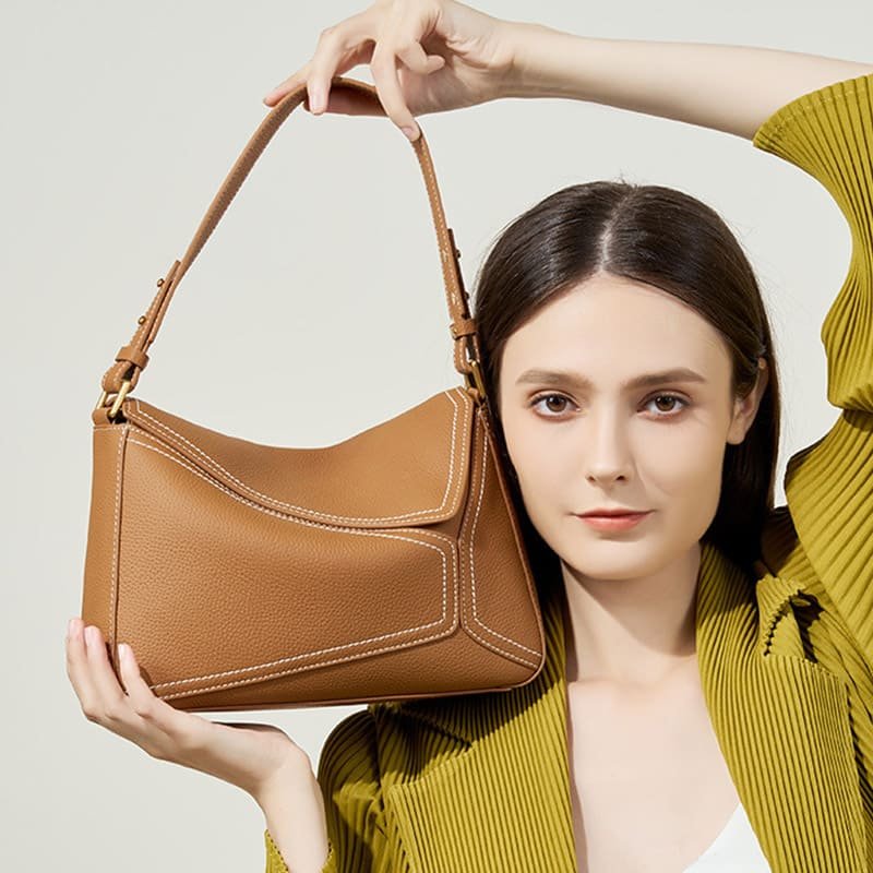 Structured flap handbag made from coated split leather